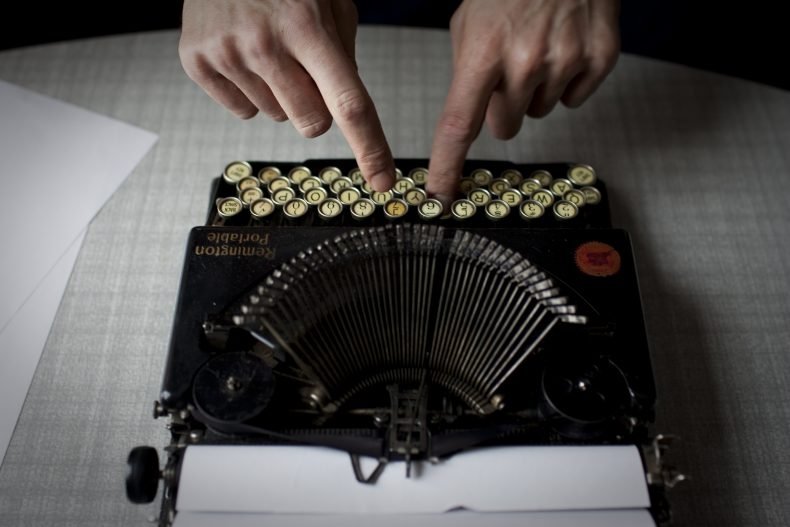 Willarde Carlson, known locally as "Sunny-Man", uses a branch to whip seaweed from his fishing nets. Local fishermen claim that increased river temperatures are causing more seaweed to appear than they have ever seen before. It must be cleaned daily or it will alert salmon to the presence of nets in the water.